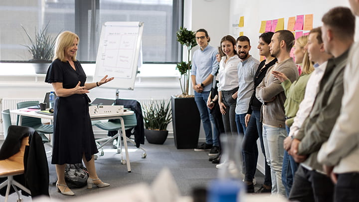 Participants in training standing in front of the teacher