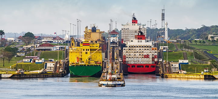 two cargo ships entering the miraflores locks in the panama canal