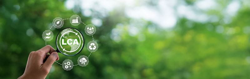Green background featuring a circular design with icons representing recycling, circularity, and sustainability. At the the acronym 'LCA'